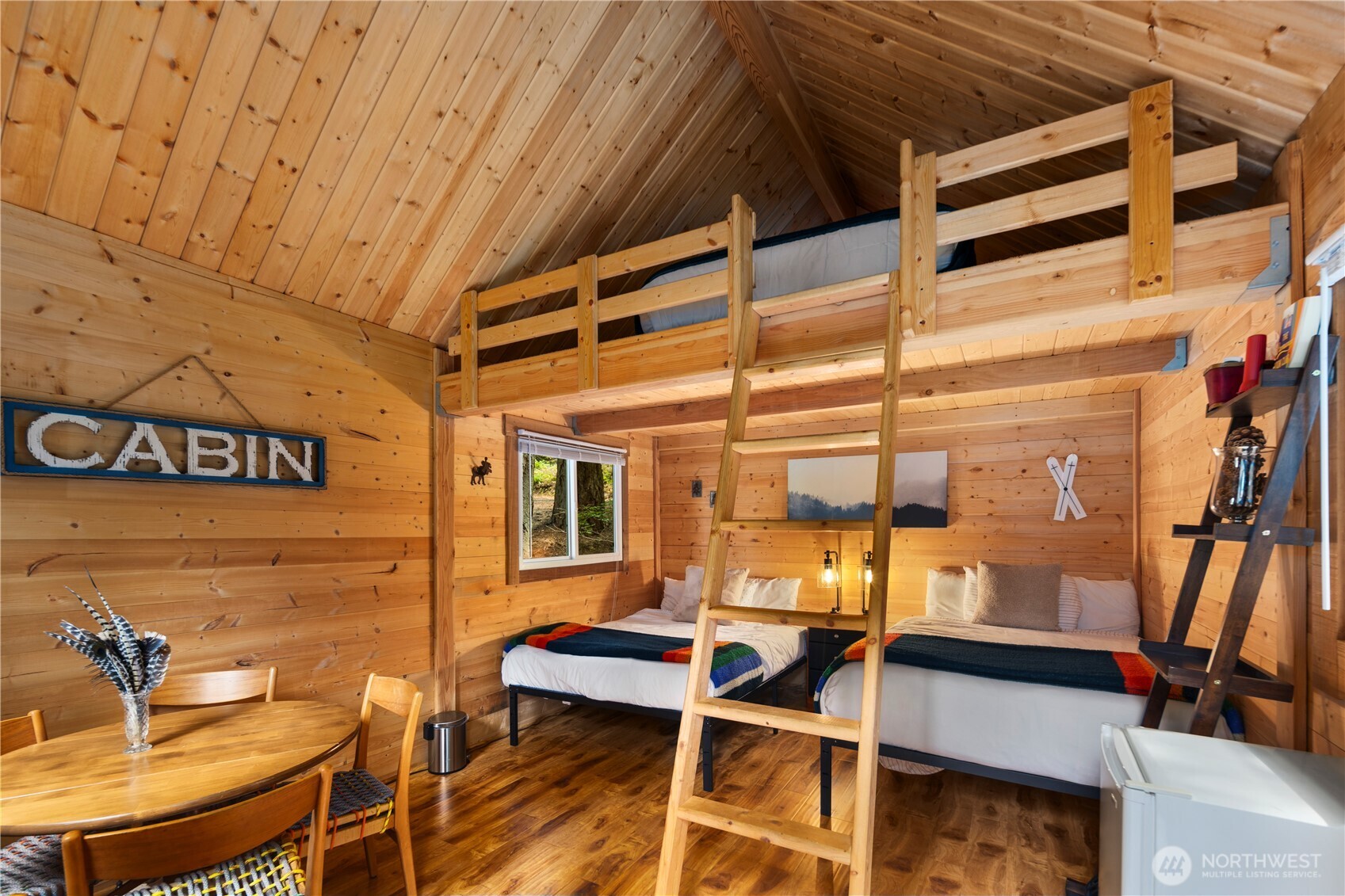 61 Hideaway Lane Ronald, WA 98940 - Photo 18 of 30 a view of a patio with table and chairs with wooden floor and fence