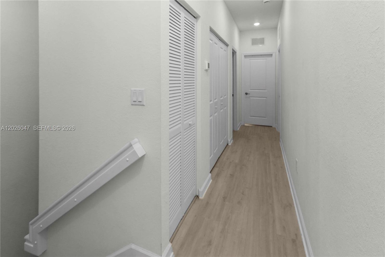 12862 Southwest 231st Street Miami, FL 33170 - Photo 28 of 30 a view of a hallway with wooden floor