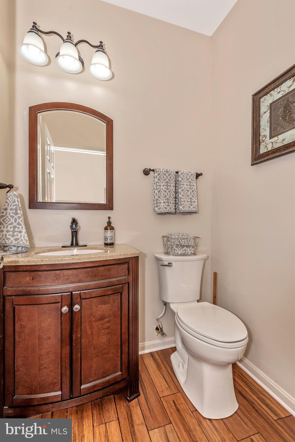 3522 Hooper Road New Windsor, MD 21776 - Photo 14 of 43 a spacious bathroom with a toilet sink and mirror