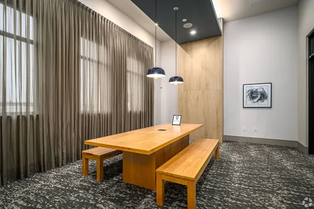 a room with pool table and a chandelier