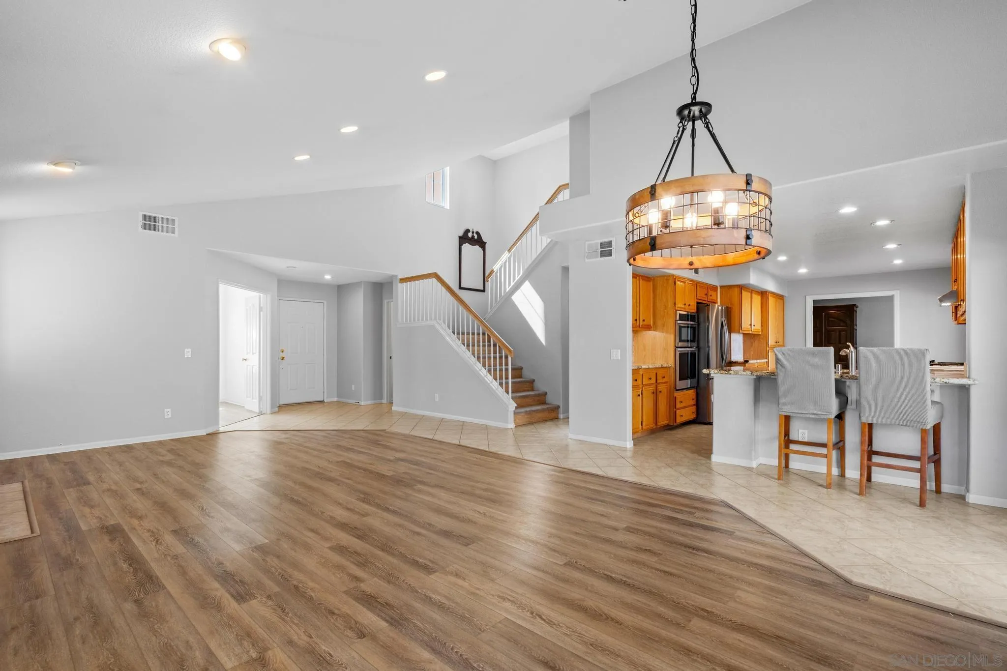 2028 Boulders Road Alpine, CA 91901 - Photo 12 of 56 a view of a room with wooden floor chandelier and entryway