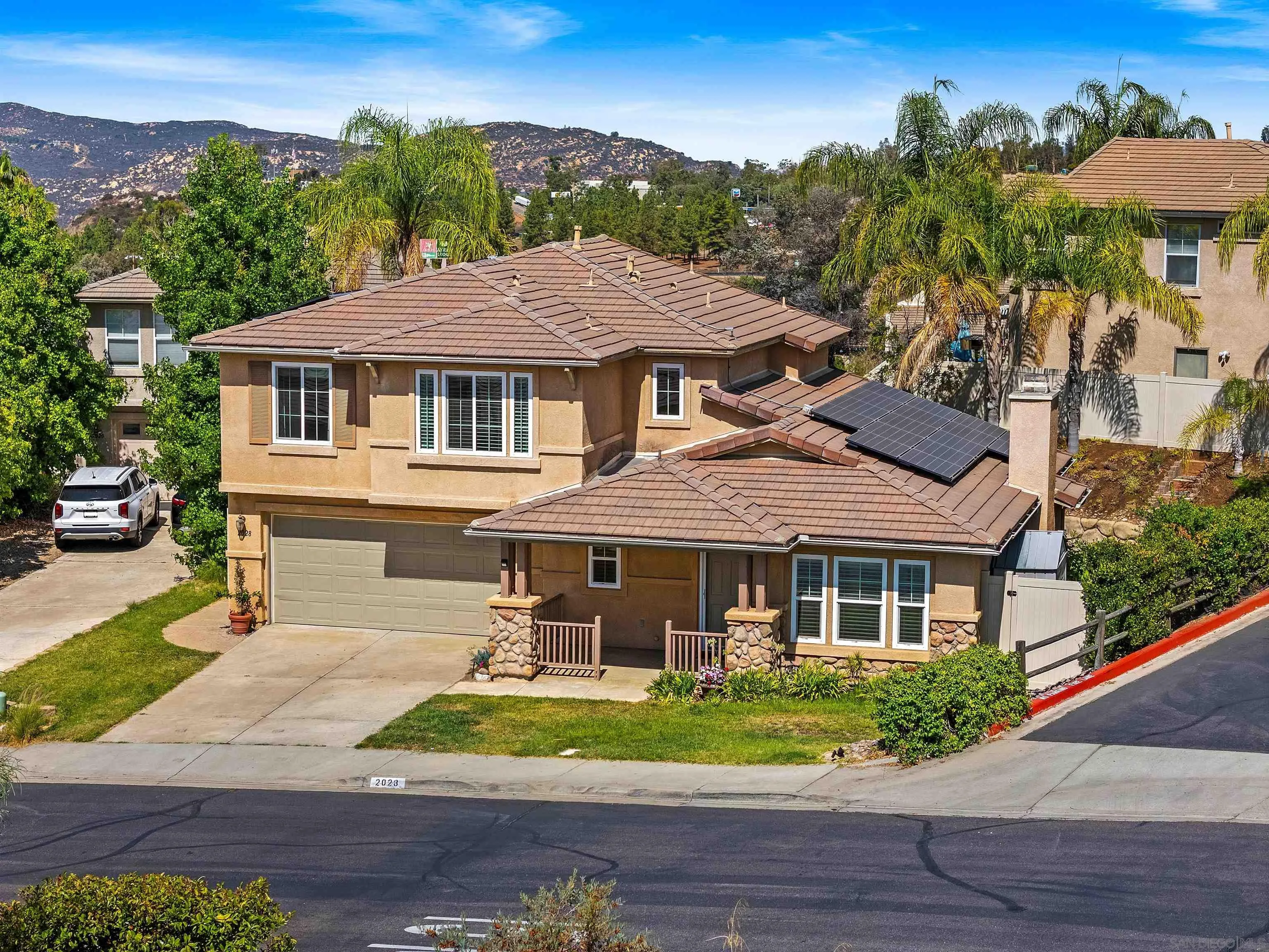 2028 Boulders Road Alpine, CA 91901 - Photo 2 of 56 front view of a house with a yard