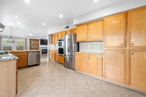 a kitchen with stainless steel appliances granite countertop a stove and a sink