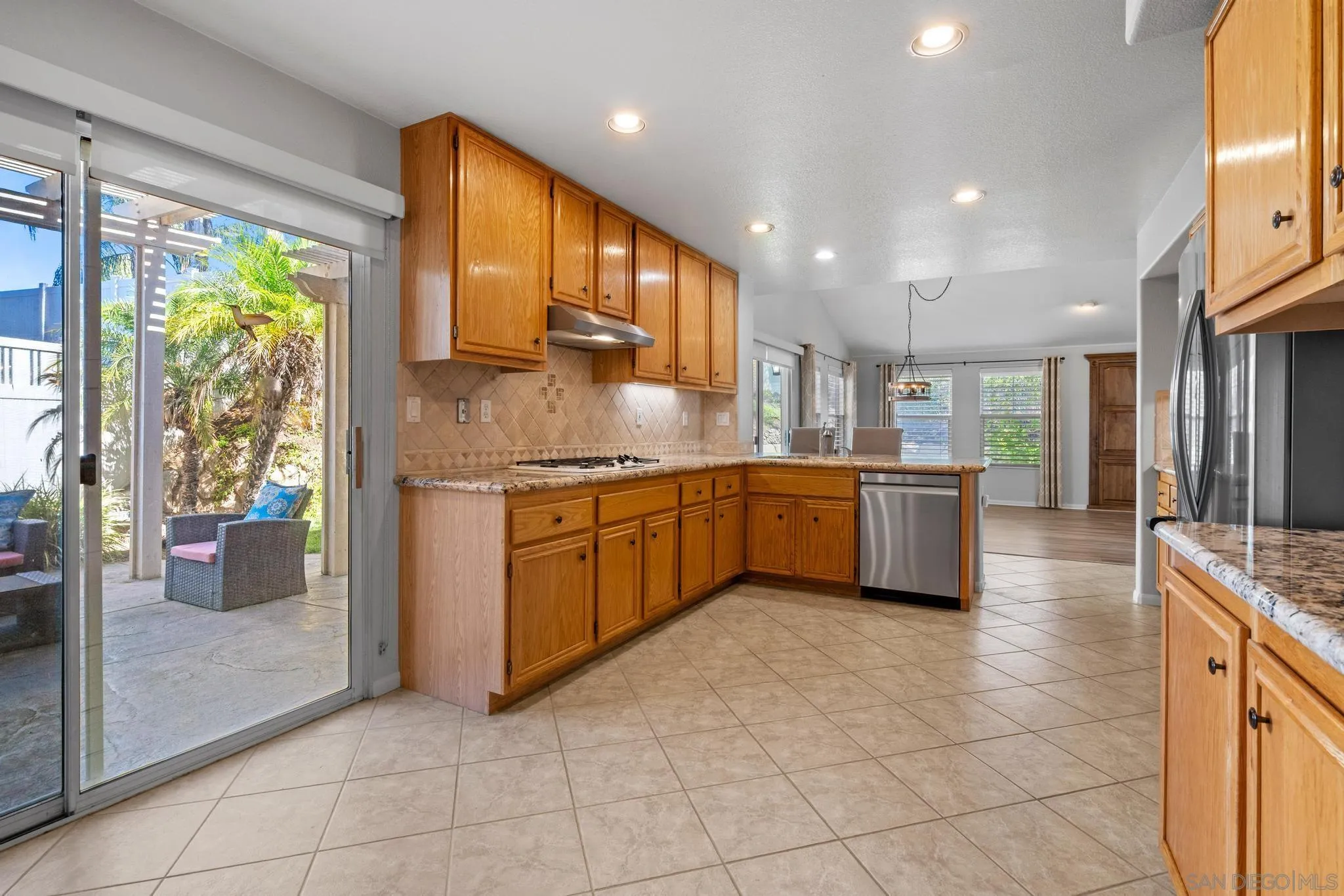2028 Boulders Road Alpine, CA 91901 - Photo 22 of 56 a kitchen with stainless steel appliances granite countertop a stove and a sink