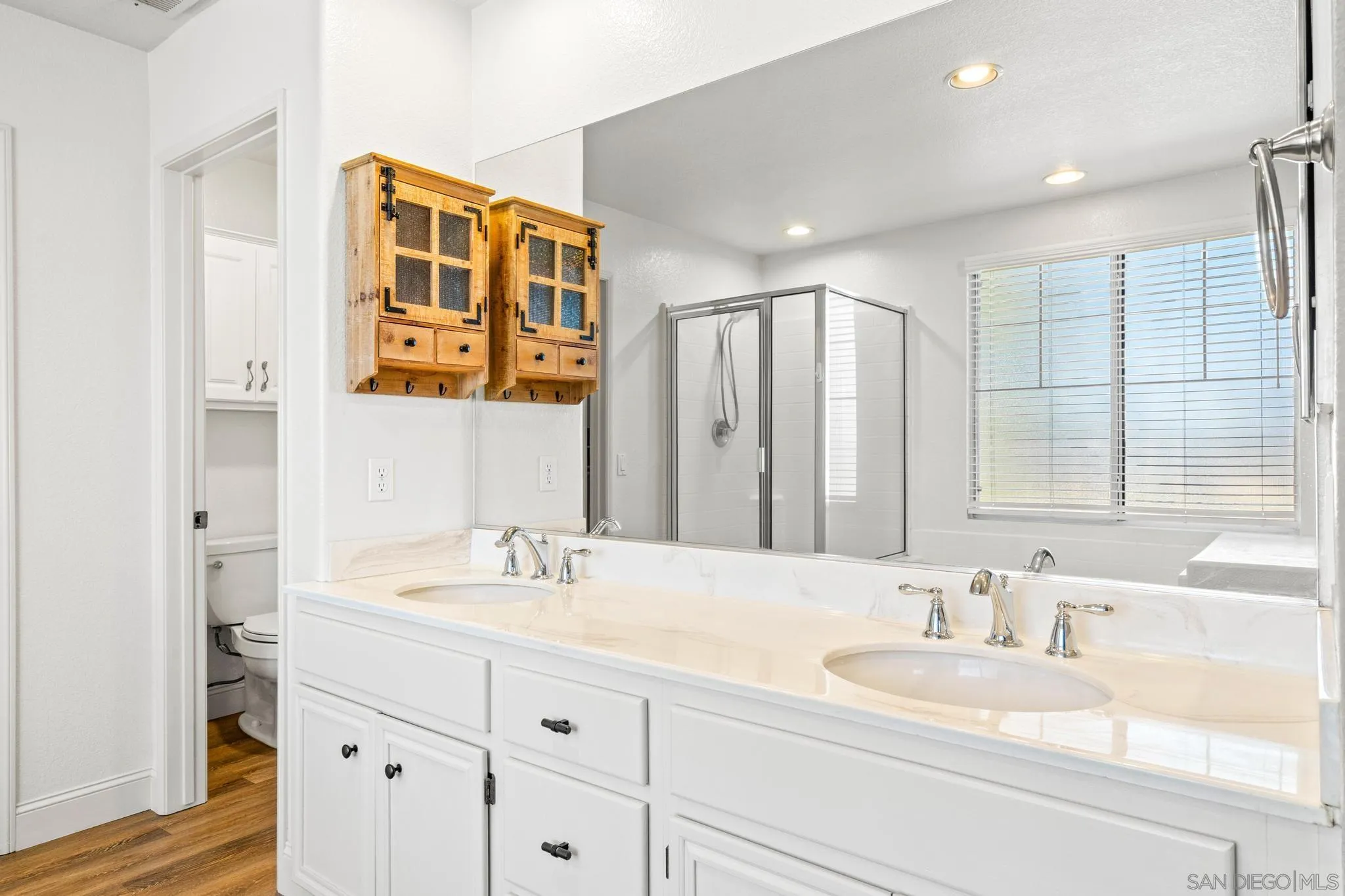 2028 Boulders Road Alpine, CA 91901 - Photo 31 of 56 a bathroom with double vanity sink and a mirror