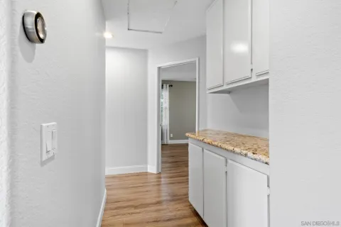 a view of a chairs and table in the back yard of the house