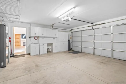 a patio with couch and potted plants