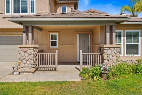 front view of a house with a bench