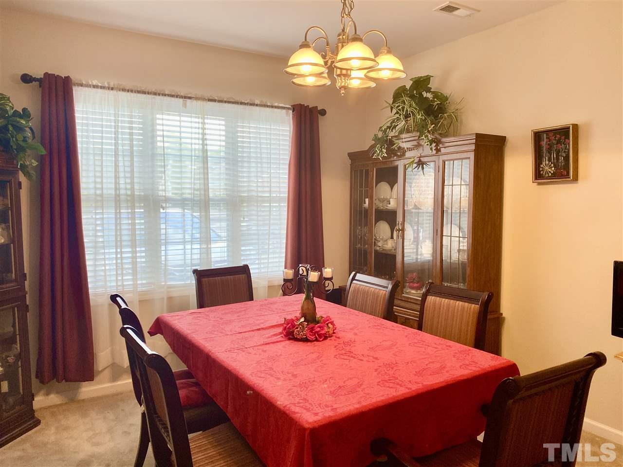 2746 Andover Glen Road Raleigh, NC 27604 - Photo 15 of 30 a view of a dining room with furniture window and outside view