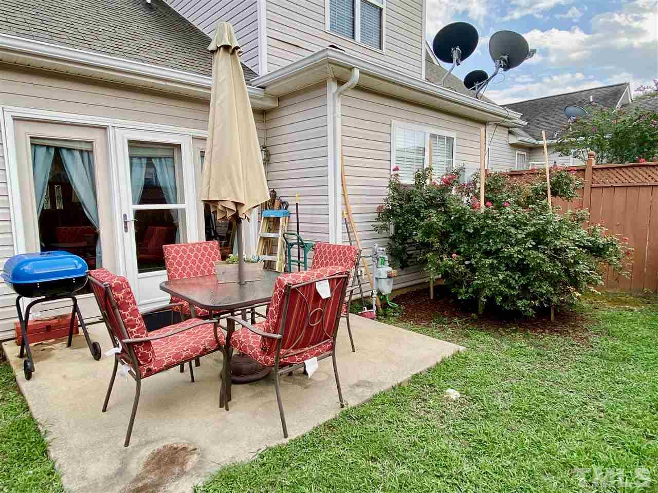 2746 Andover Glen Road Raleigh, NC 27604 - Photo 25 of 30 a view of a house with backyard sitting area and garden