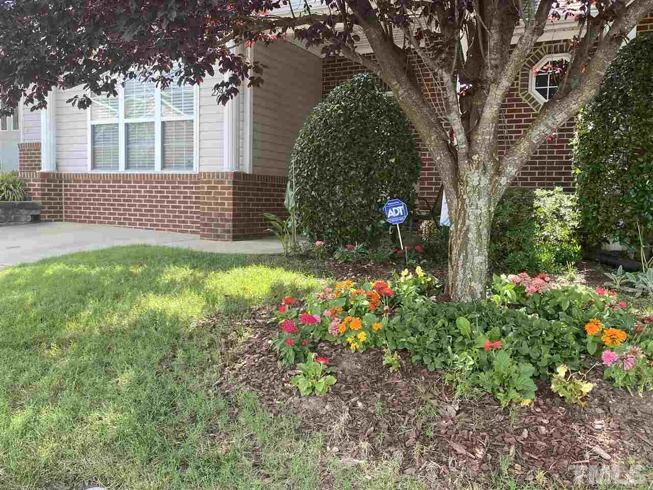 2746 Andover Glen Road Raleigh, NC 27604 - Photo 4 of 30 a backyard of a house with lots of green space and fountain