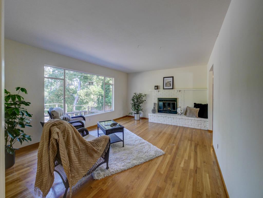 16 Oak Road Santa Cruz, CA 95060 - Photo 6 of 27 a living room with furniture and a fireplace