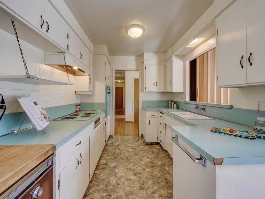 16 Oak Road Santa Cruz, CA 95060 - Photo 8 of 27 a kitchen with a stove a sink and a refrigerator