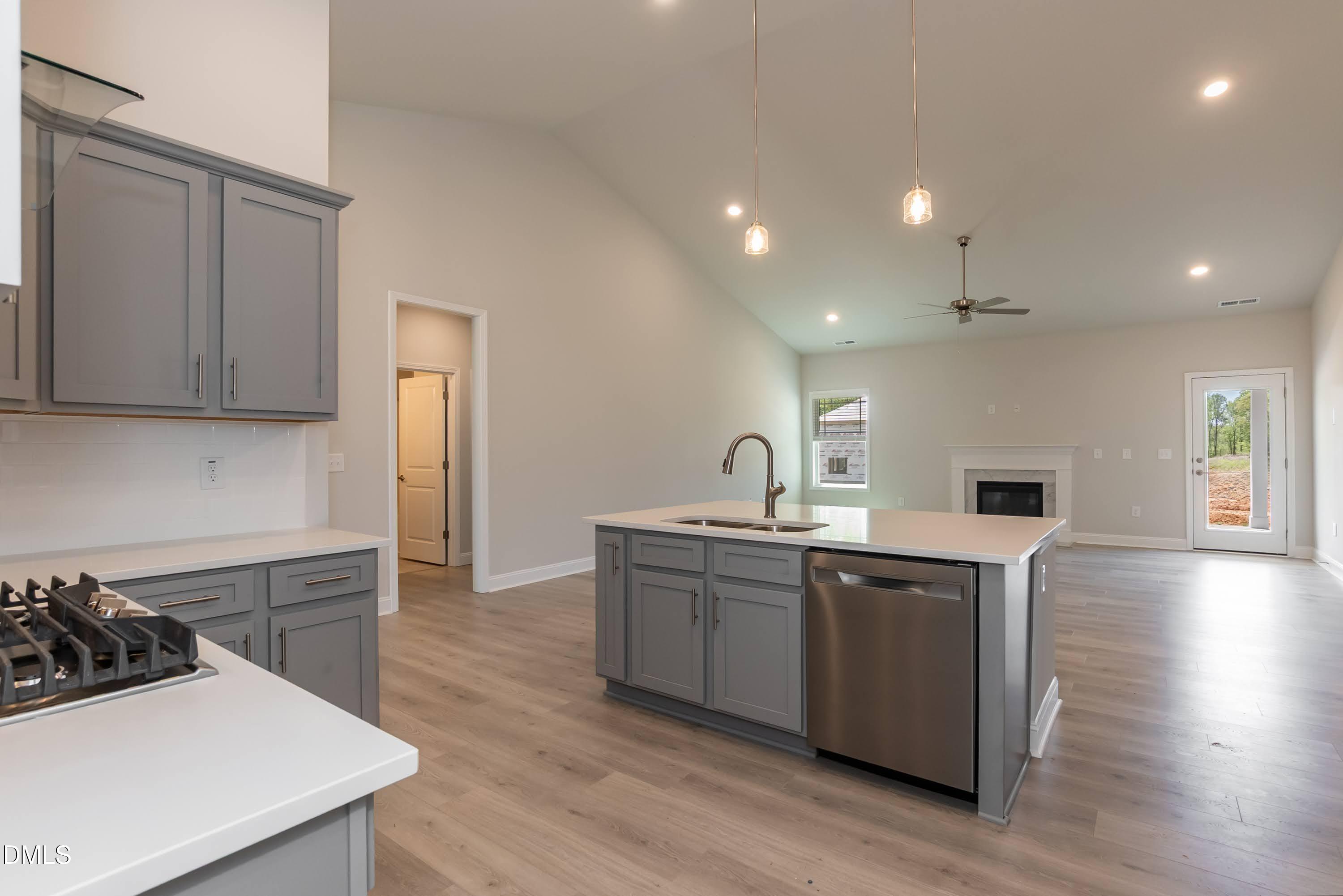 1 Galway Road Lillington, NC 27546 - Photo 10 of 30 a kitchen with sink a stove and cabinets