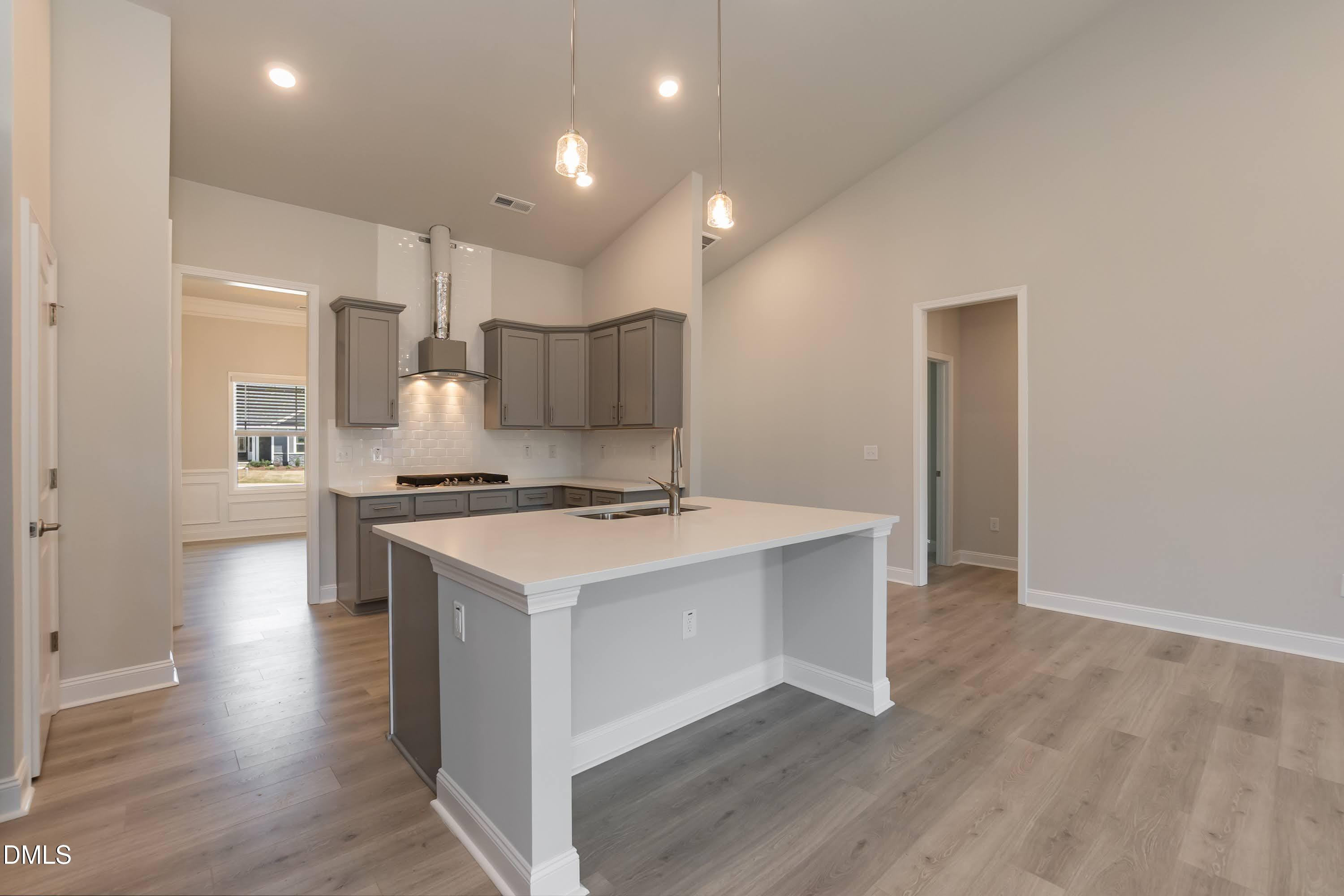1 Galway Road Lillington, NC 27546 - Photo 11 of 30 a kitchen with a stove a sink and a refrigerator