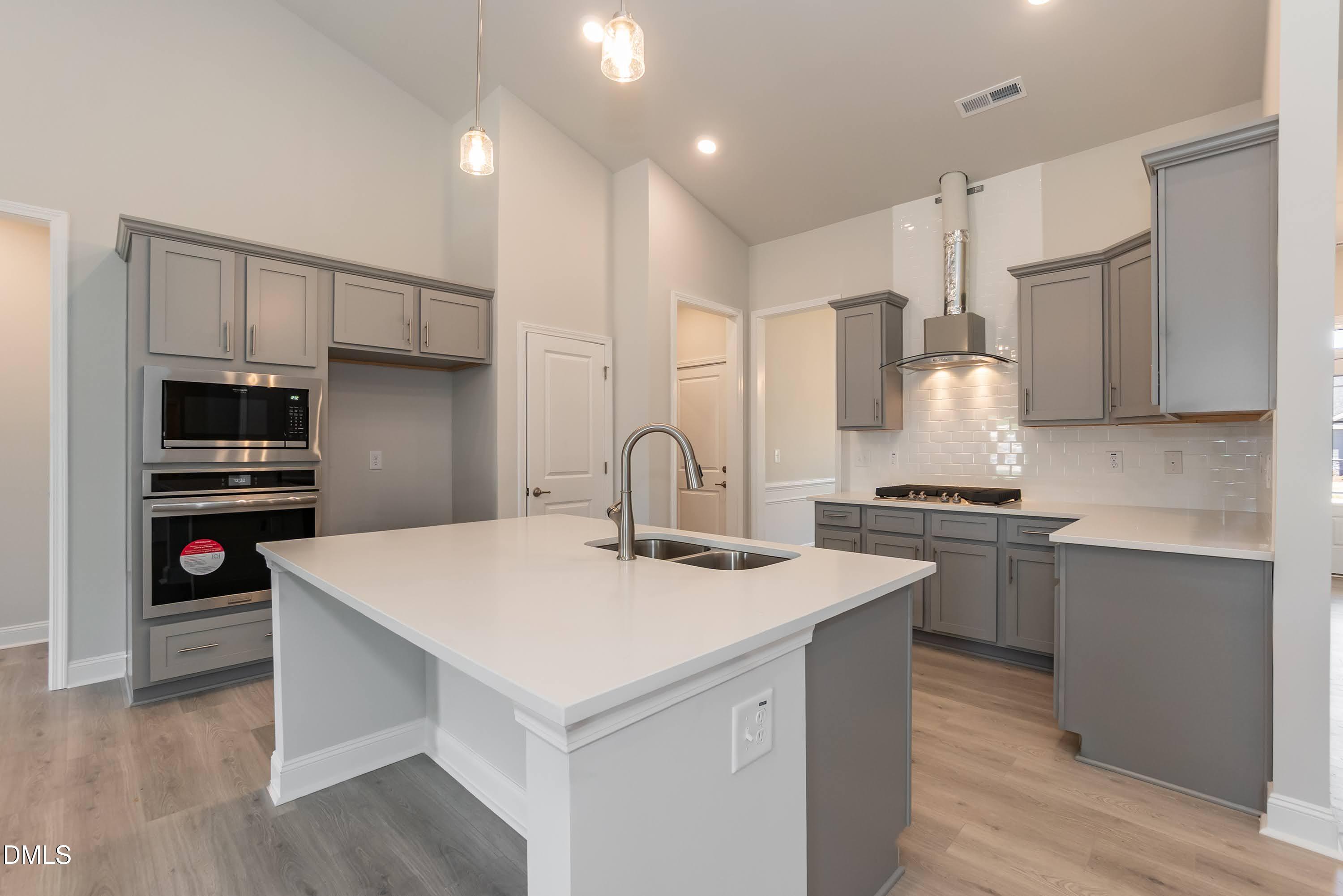 1 Galway Road Lillington, NC 27546 - Photo 13 of 30 a kitchen with a sink a stove a refrigerator and a stove