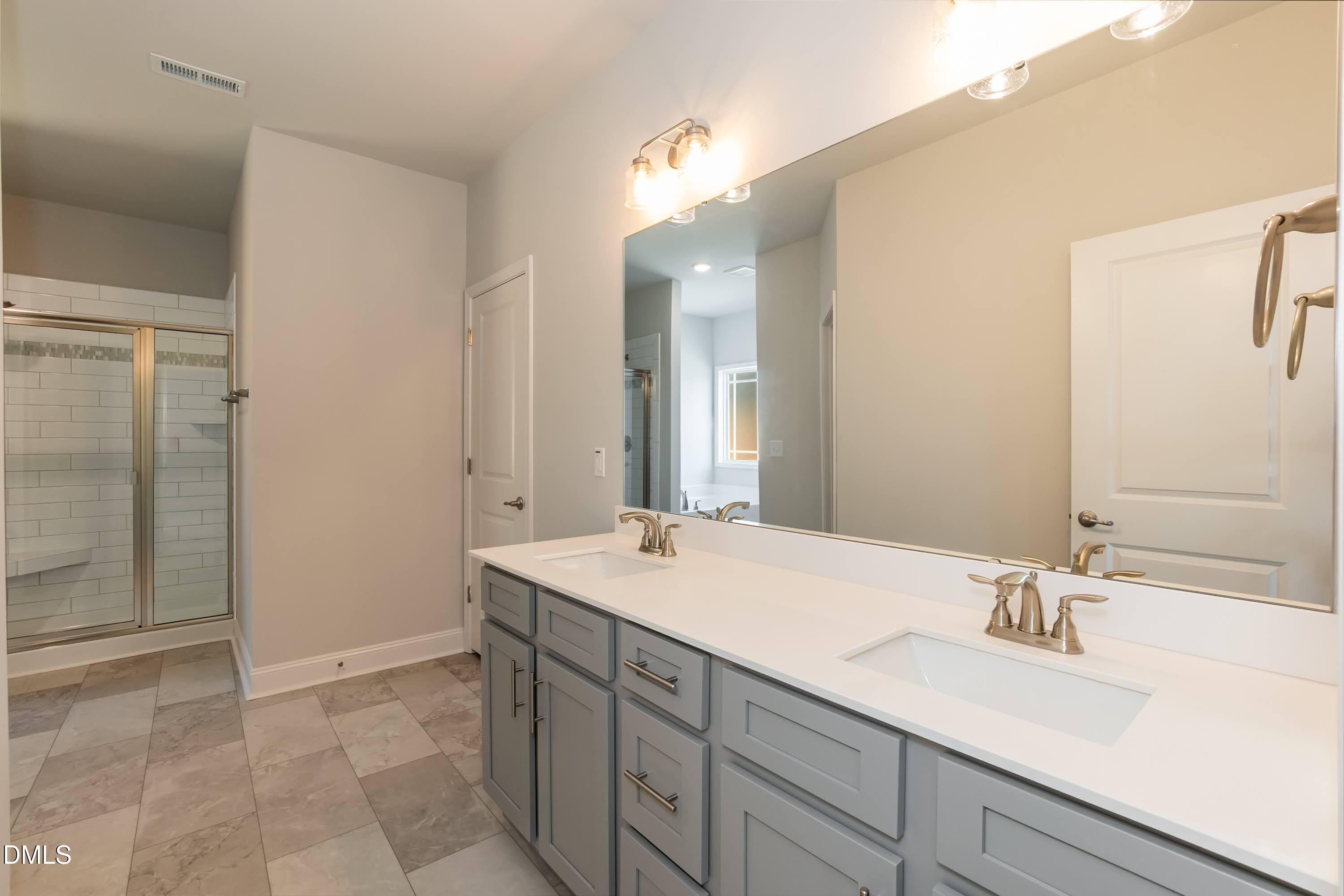 1 Galway Road Lillington, NC 27546 - Photo 20 of 30 a bathroom with a sink and a mirror