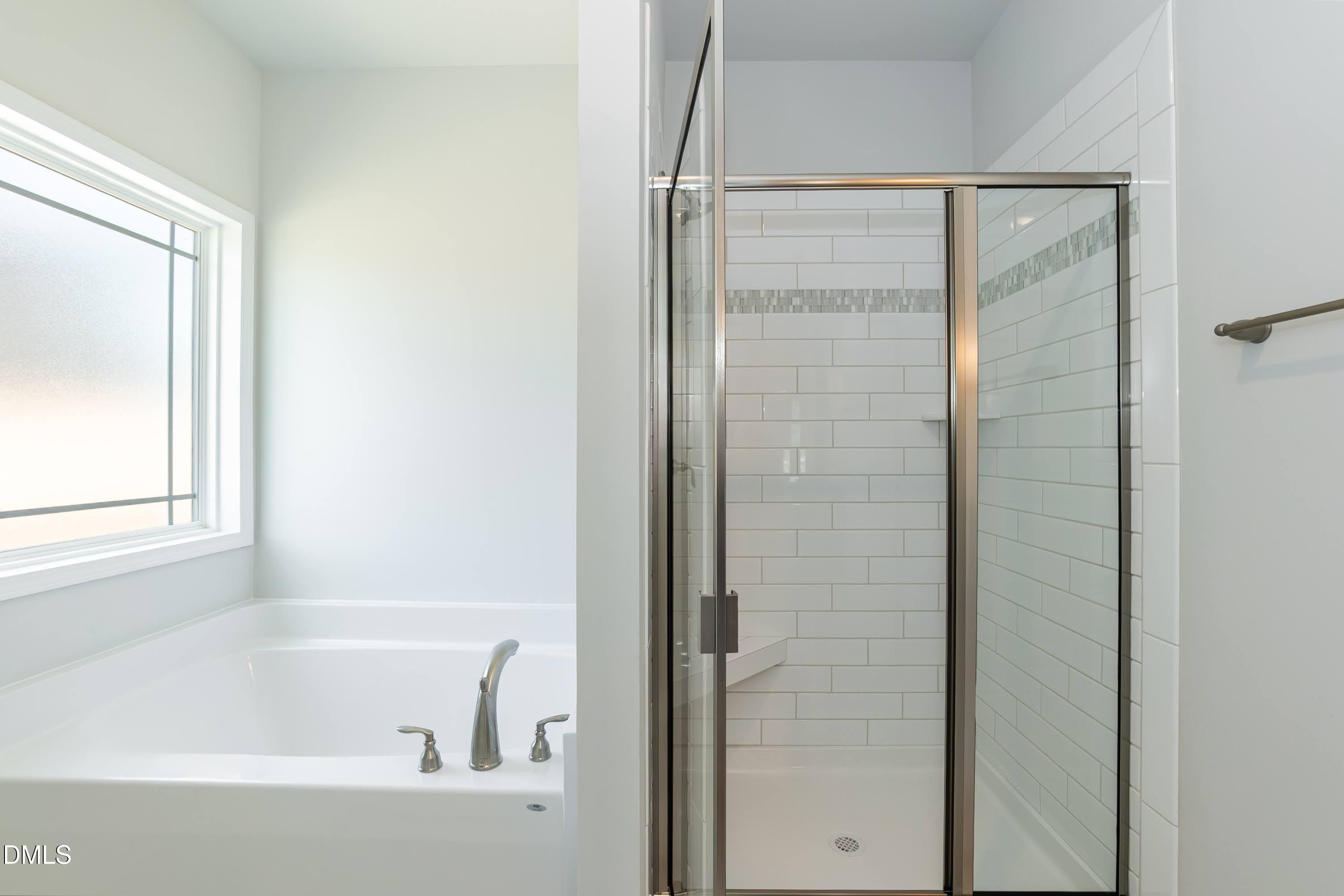 1 Galway Road Lillington, NC 27546 - Photo 21 of 30 a bathroom with a bathtub and a shower