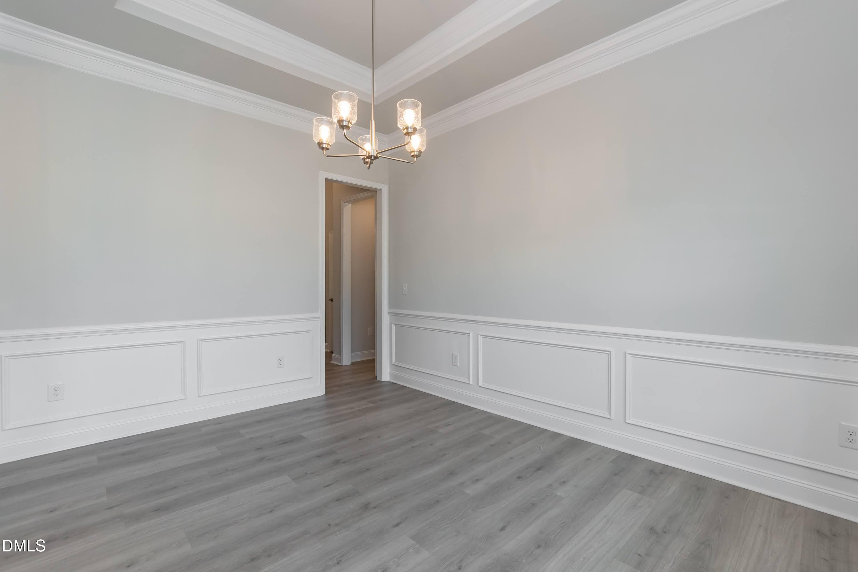 1 Galway Road Lillington, NC 27546 - Photo 5 of 30 a view of an empty room with wooden floor