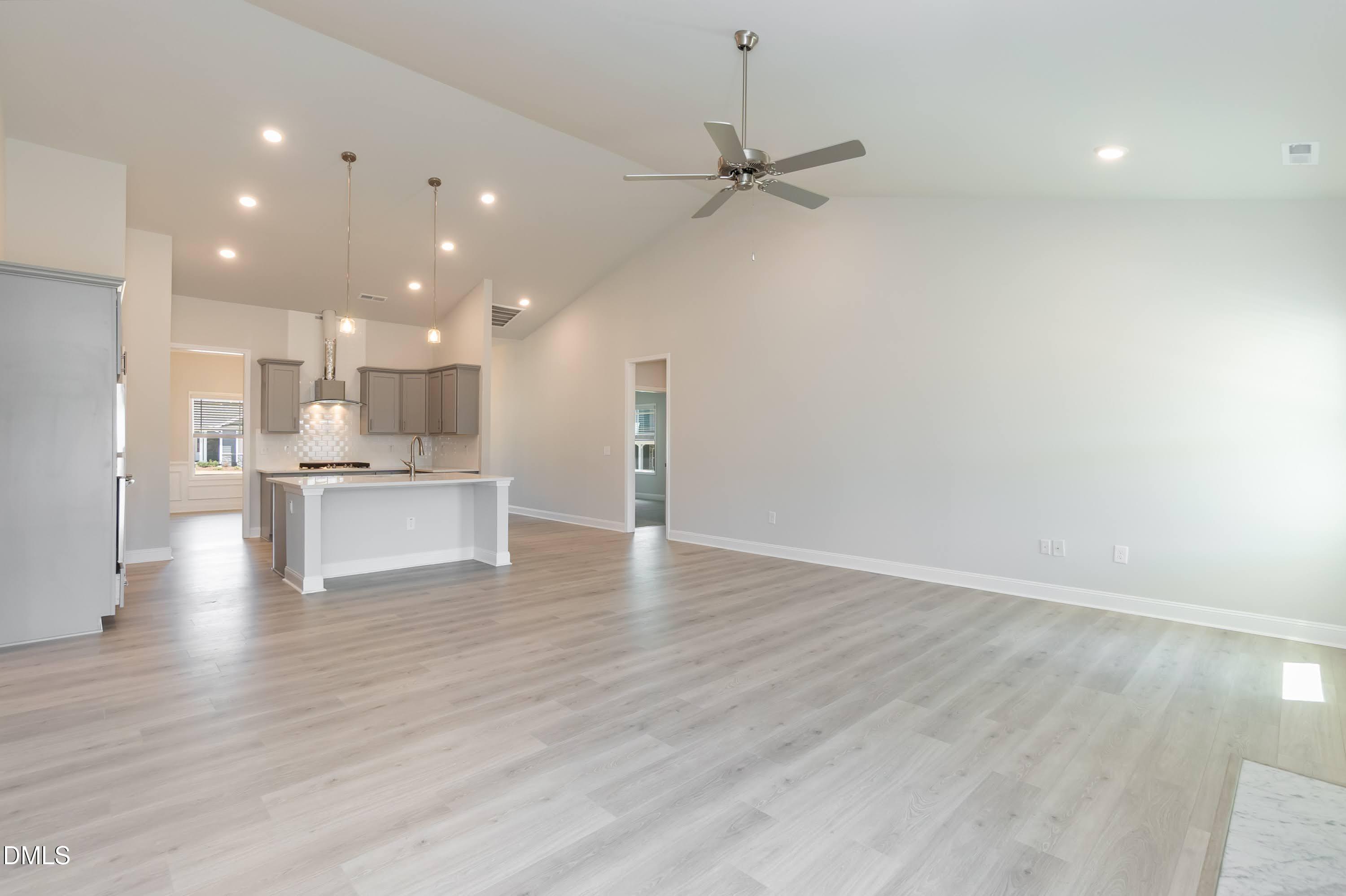 1 Galway Road Lillington, NC 27546 - Photo 8 of 30 a view of kitchen with kitchen island white cabinetry and wooden floor