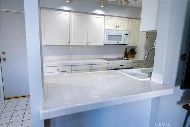 a view of a dining room with tables and chairs