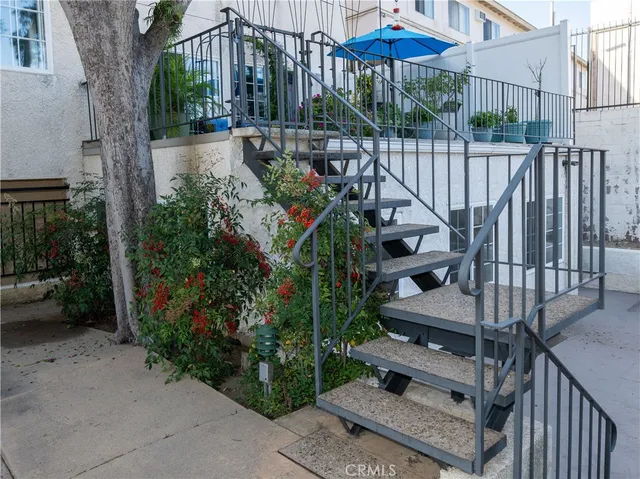a view of a chairs and table in the patio