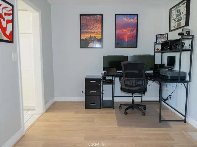 a living room with furniture wooden floor and a table