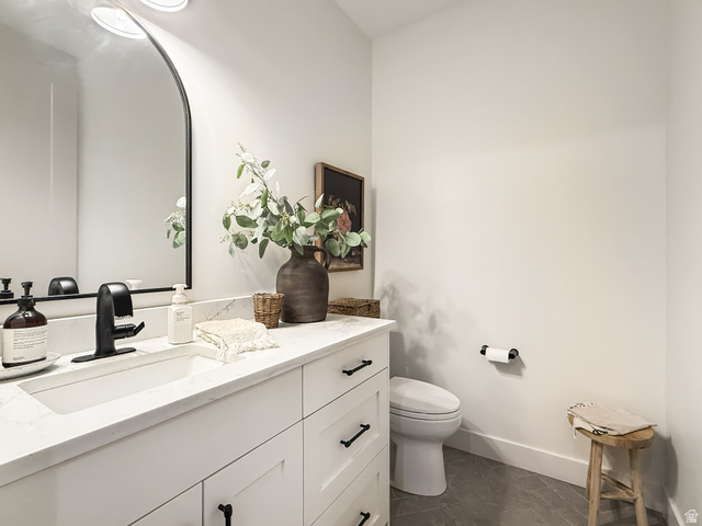 916 Rocky Mountain Way Elk Ridge, UT 84651 - Photo 35 of 54 Bathroom featuring vanity and toilet