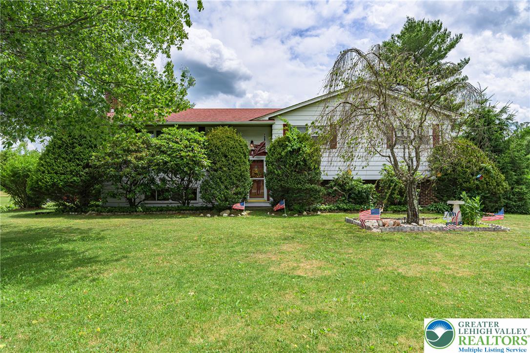 678 Interchange Road Kresgeville, PA 18333 - Photo 38 of 45 Well-maintained landscaping and a spacious front lawn frame this welcoming two-story residence.