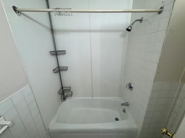 a close view of a bathtub in bathroom
