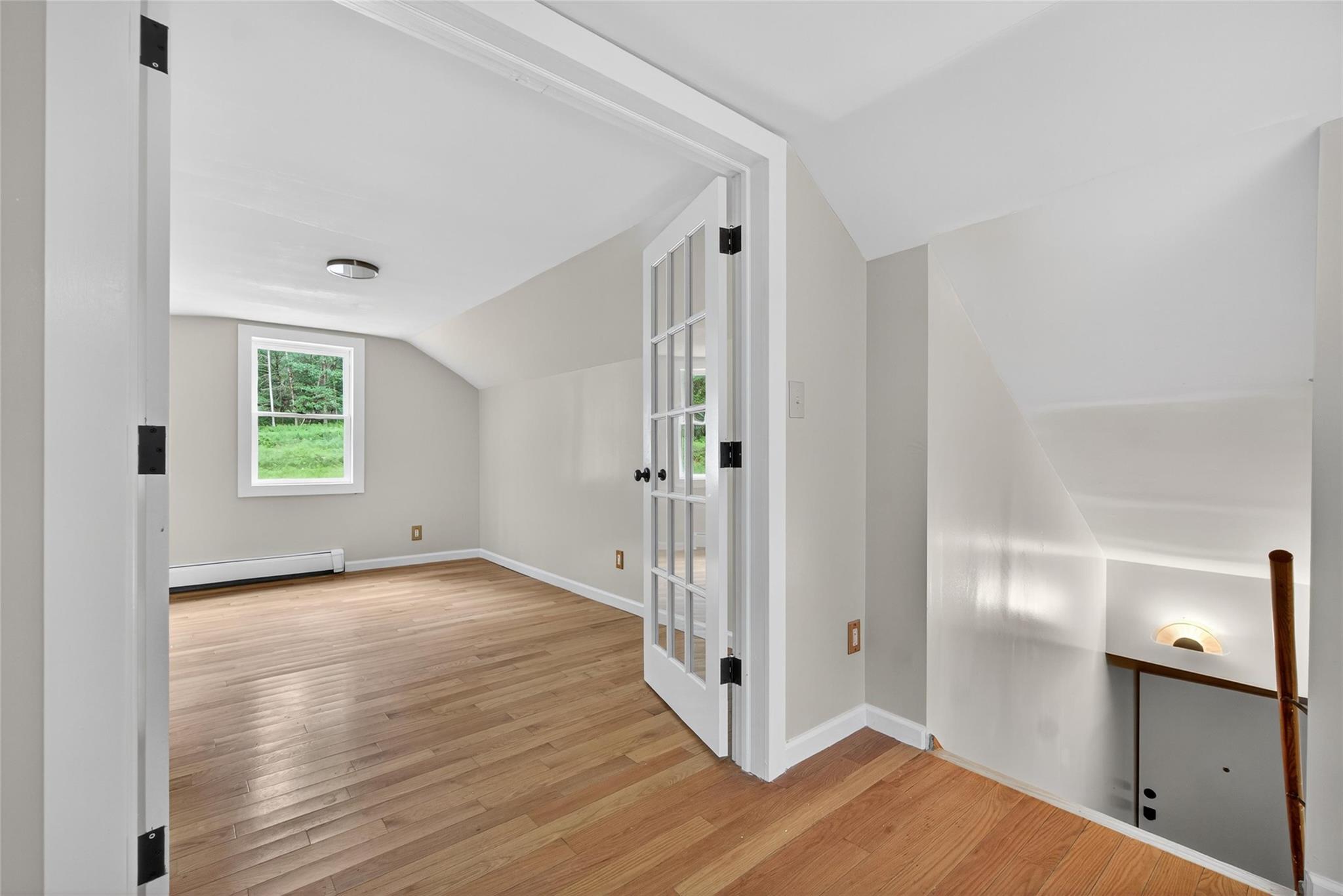 52 Luxton Lake Road Narrowsburg, NY 12764 - Photo 29 of 38 a view of a hallway with wooden floor and a window
