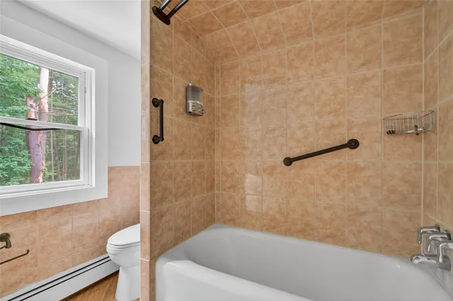 a bathroom with a shower and a bathtub