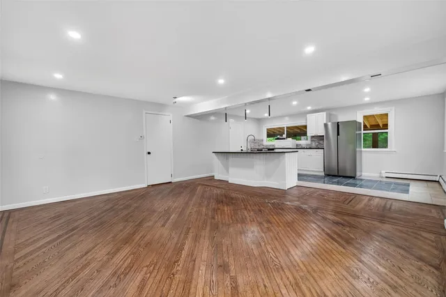 a view of kitchen with wooden floor