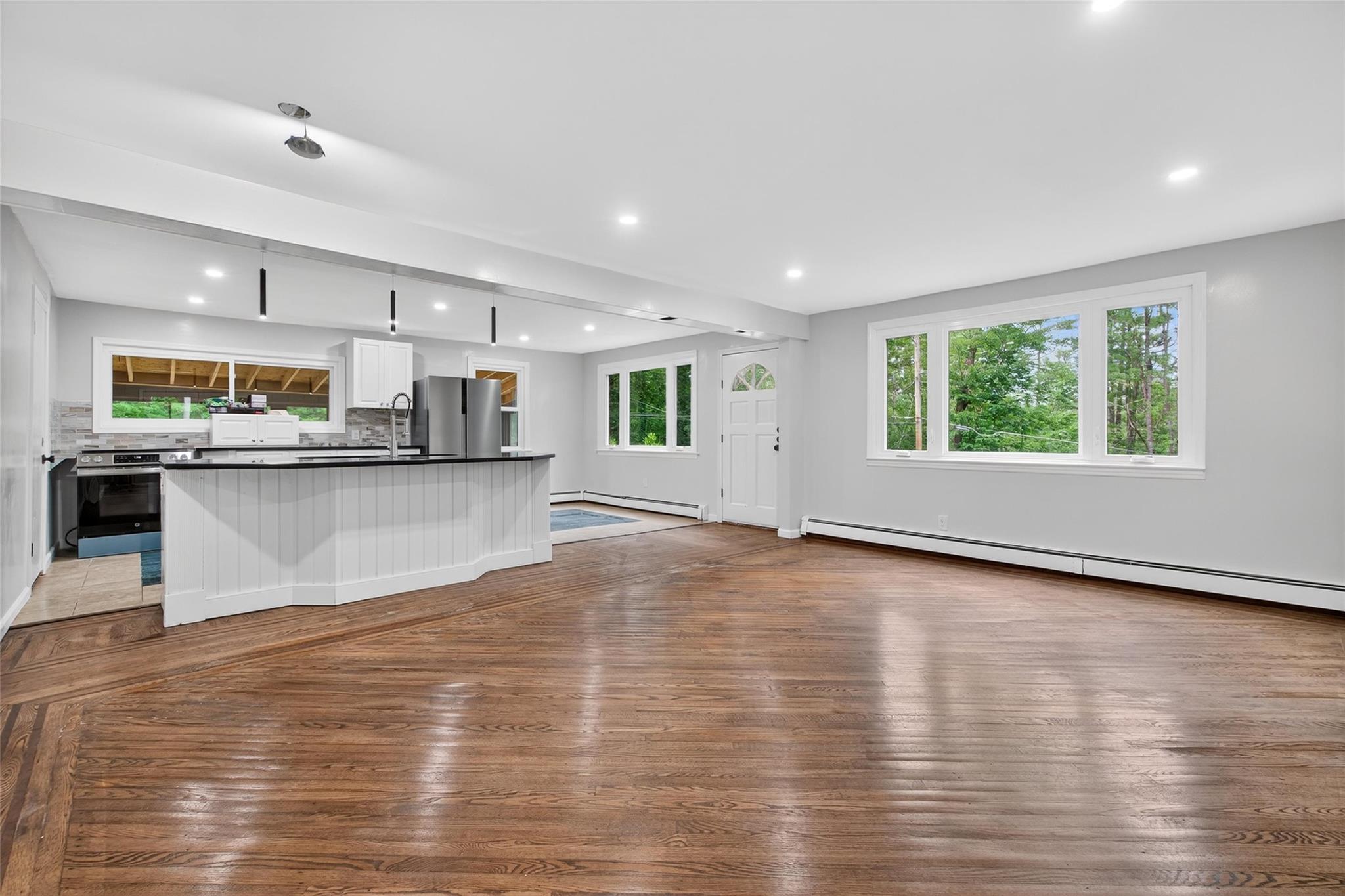 52 Luxton Lake Road Narrowsburg, NY 12764 - Photo 6 of 38 a view of a kitchen with kitchen island a counter top space a sink stainless steel appliances and cabinets