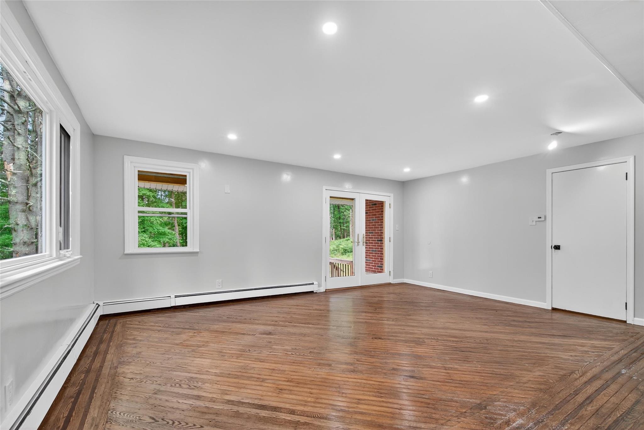 52 Luxton Lake Road Narrowsburg, NY 12764 - Photo 10 of 38 wooden floor in an empty room with a window