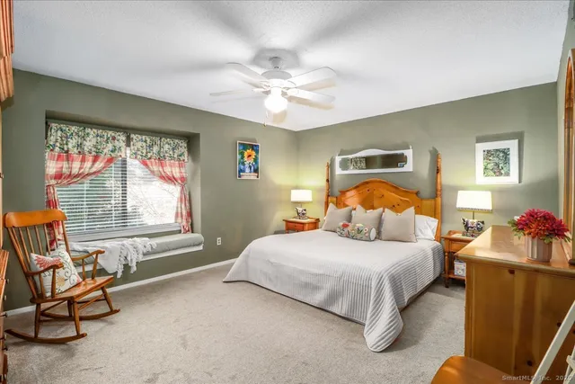 a bedroom with a bed and a couch