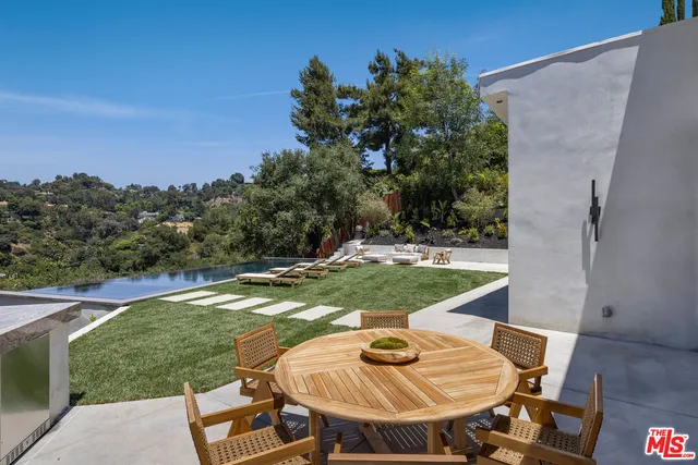 a view of a backyard with furniture
