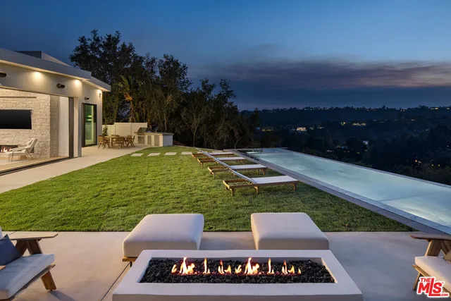 a view of a swimming pool with chairs
