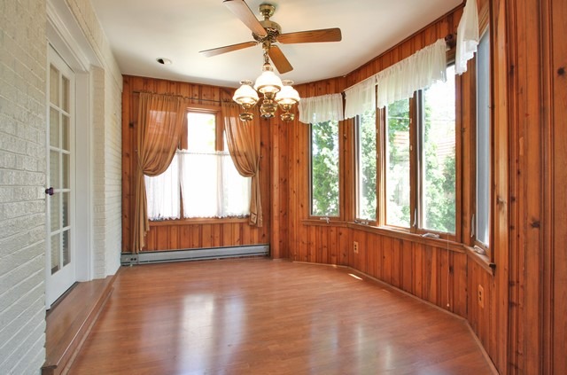 17 North Merrill Street Park Ridge, IL 60068 - Photo 4 of 10 a view of an empty room with wooden floor and windows
