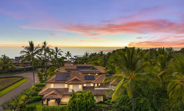 a view of a city with lawn chairs and wooden fence