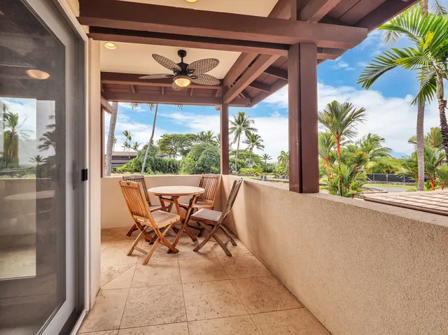 a view of a patio with table and chairs