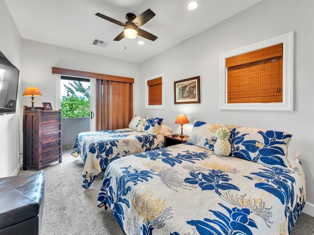 a bedroom with bed and window