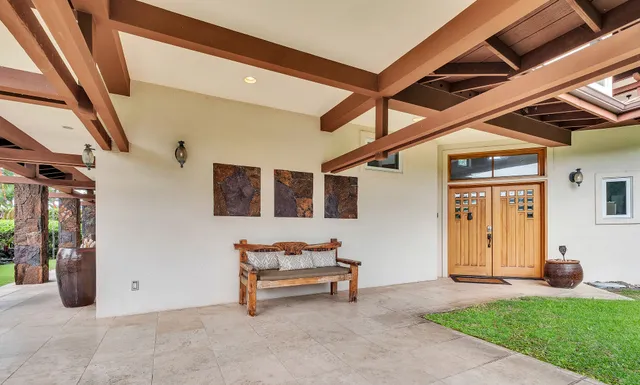 a house with porch and a bench