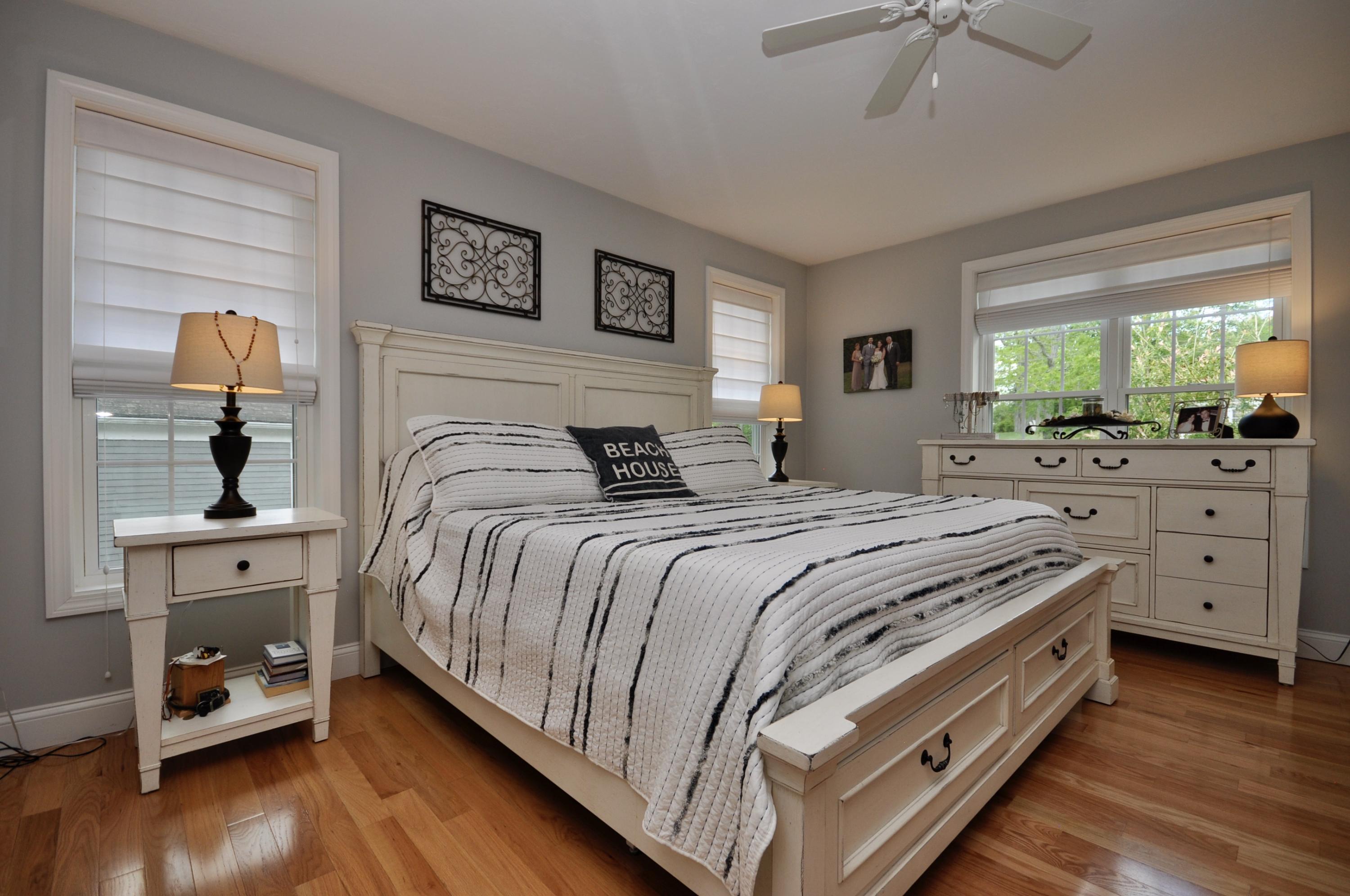 5 Bournedale Road Buzzards Bay, MA 02532 - Photo 20 of 39 a spacious bedroom with a bed and a dresser in it