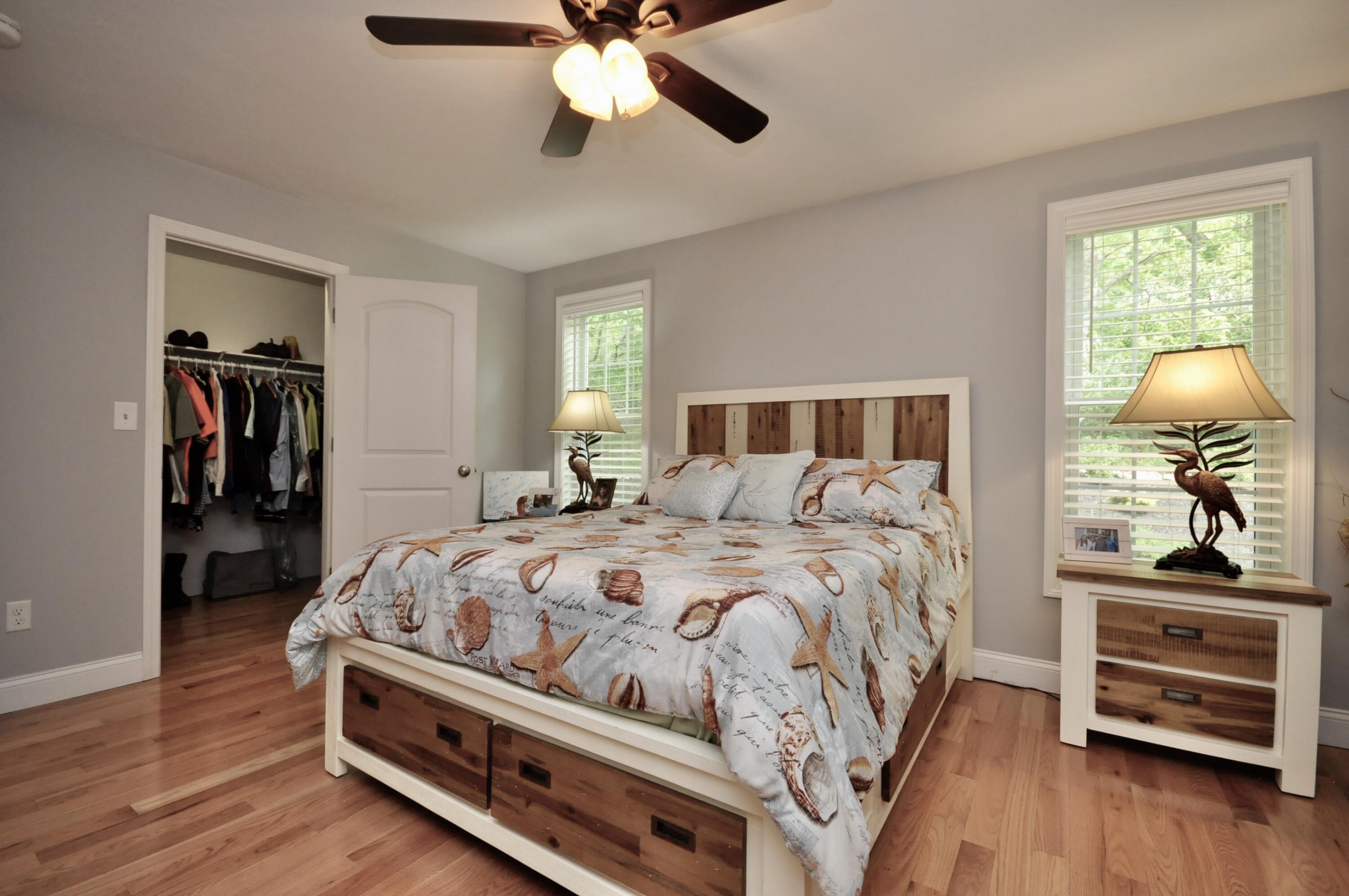5 Bournedale Road Buzzards Bay, MA 02532 - Photo 24 of 39 a bedroom with a bed and wooden floor