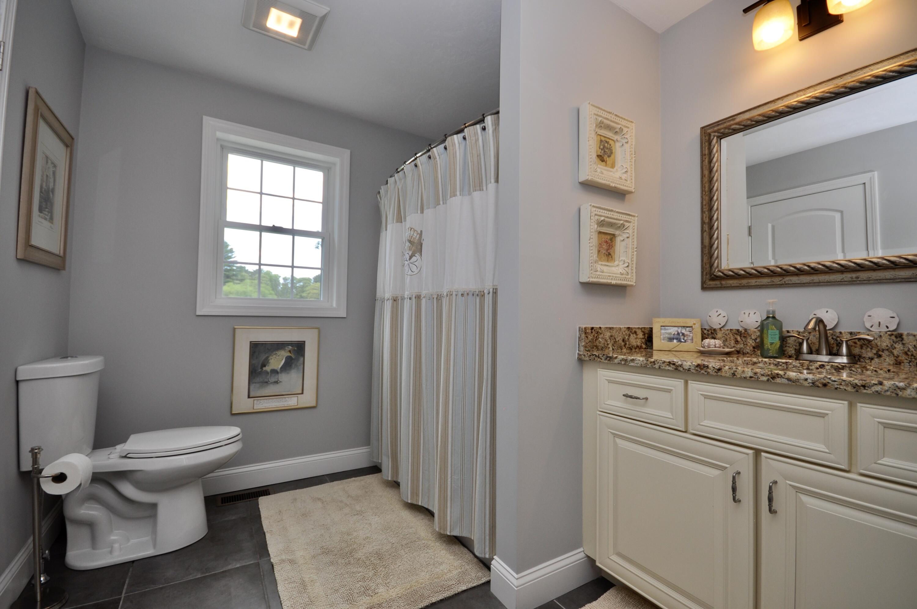 5 Bournedale Road Buzzards Bay, MA 02532 - Photo 25 of 39 a bathroom with a granite countertop toilet sink and mirror