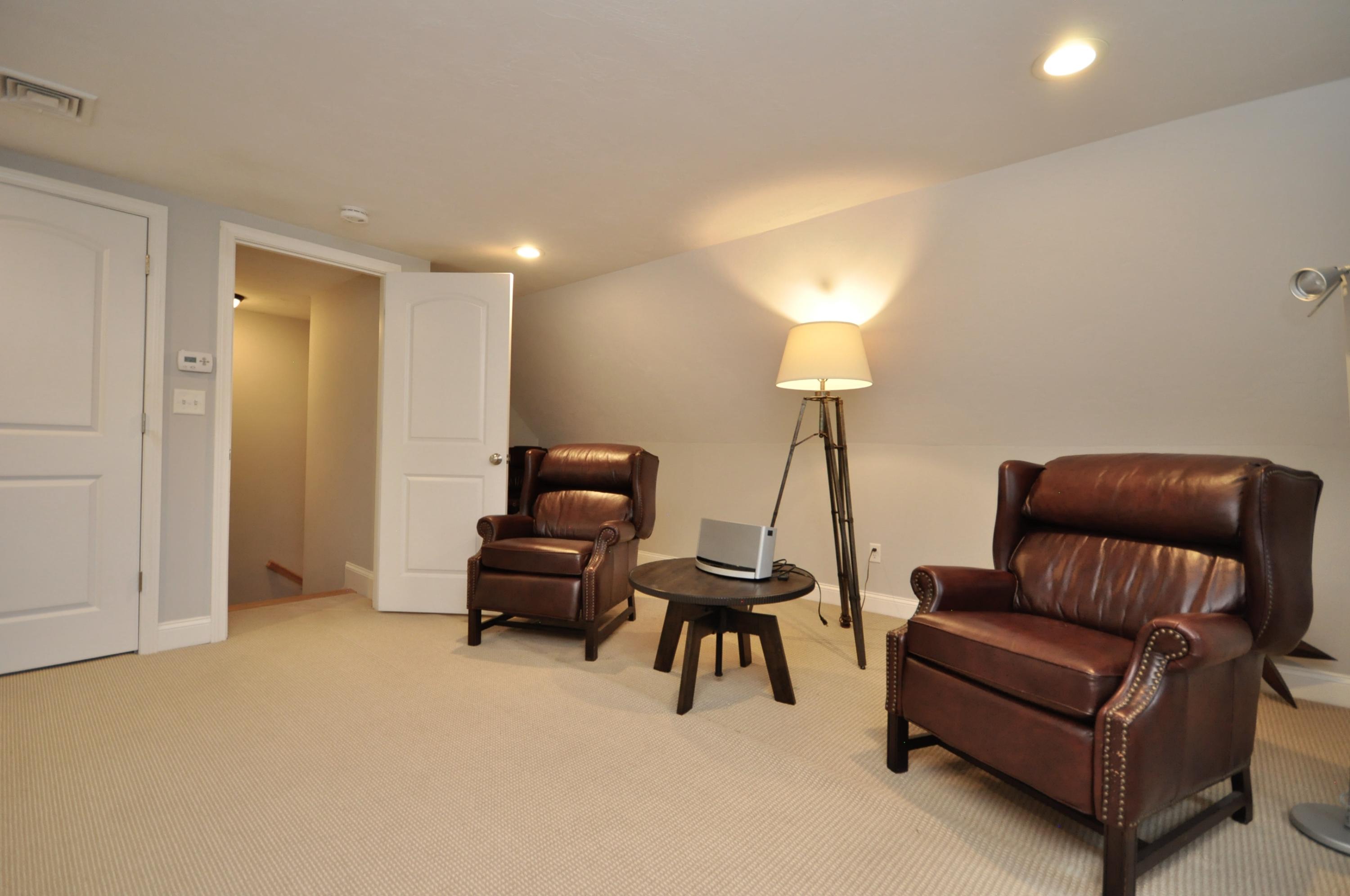 5 Bournedale Road Buzzards Bay, MA 02532 - Photo 28 of 39 a living room with furniture and a lamp
