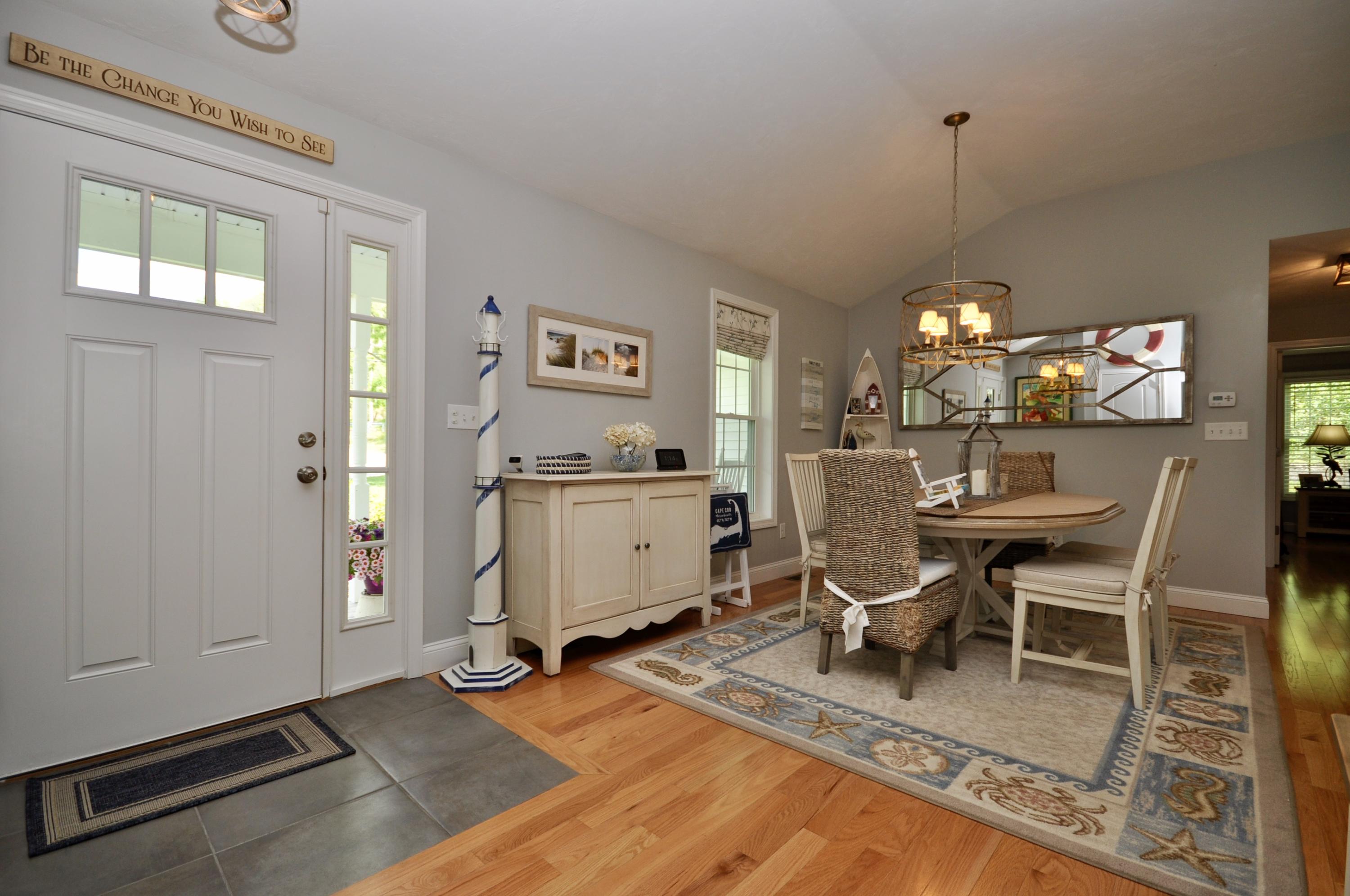 5 Bournedale Road Buzzards Bay, MA 02532 - Photo 9 of 39 a living room with furniture a dining table and a fireplace
