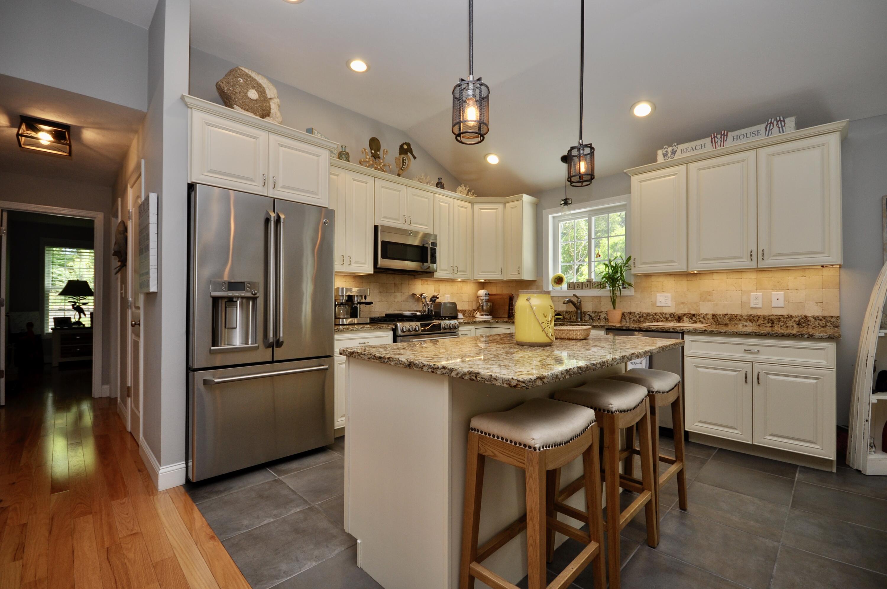 5 Bournedale Road Buzzards Bay, MA 02532 - Photo 10 of 39 a kitchen with kitchen island granite countertop appliances cabinets and a sink