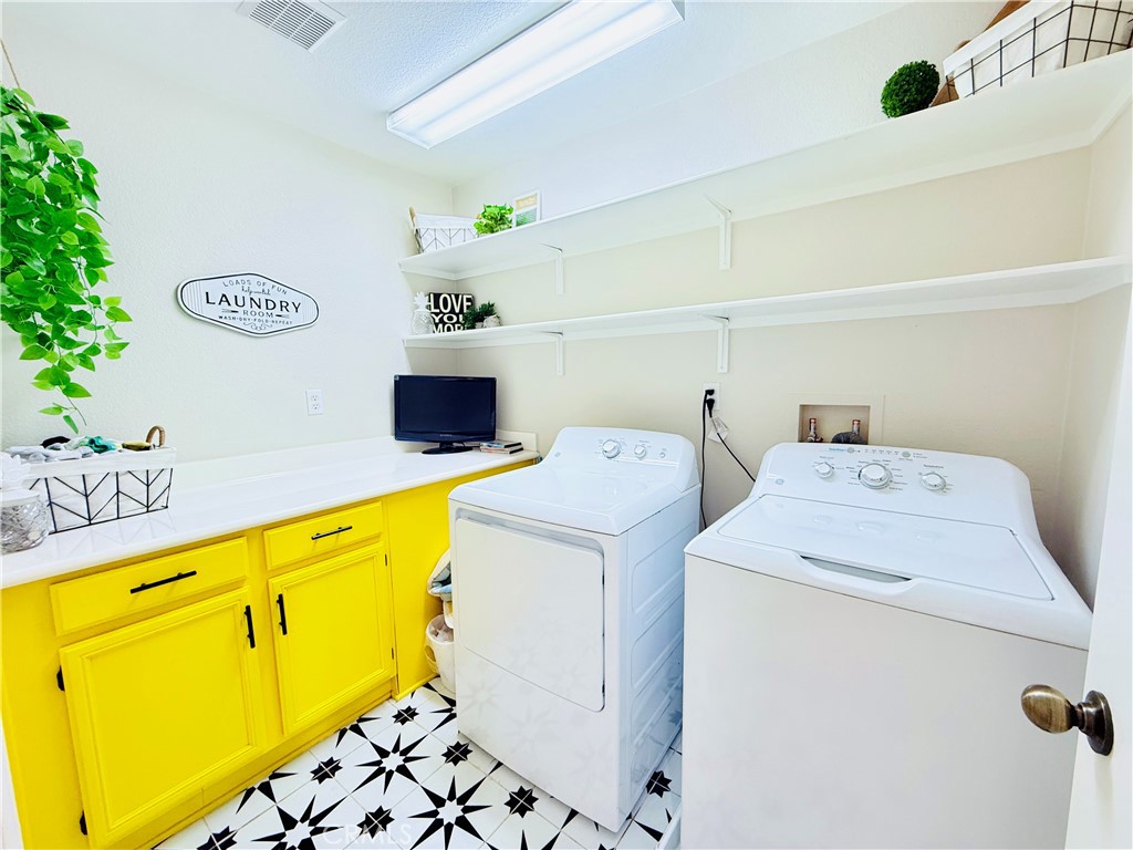1652 Apollo Way Beaumont, CA 92223 - Photo 12 of 25 a utility room with dryer and washer